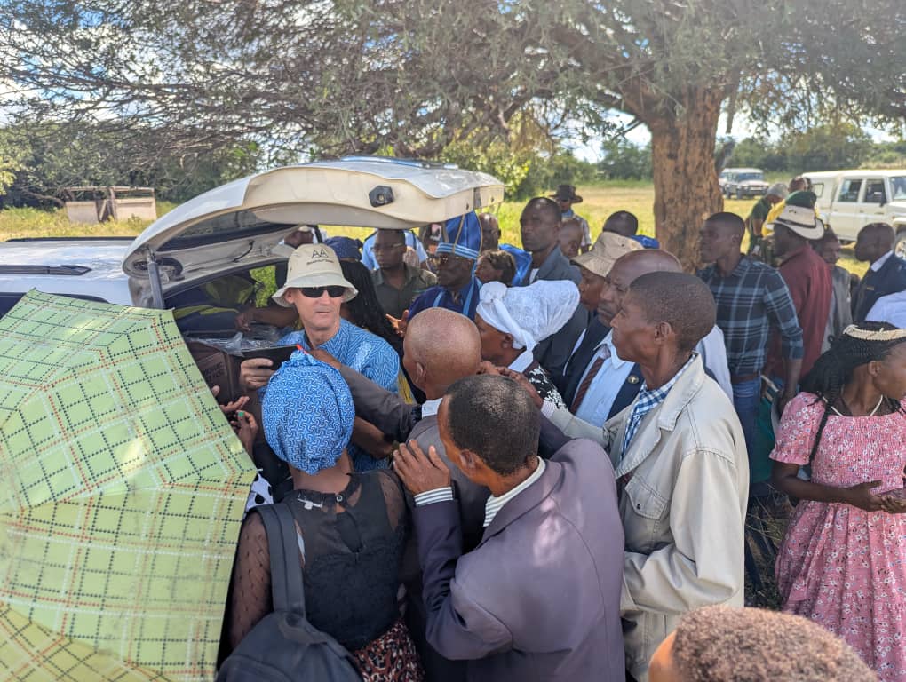 Following the certification and dedication, Khwe people were lined up to get a Bible from Lutheran Bible Translator's Rev. Dr. Tim Beckendorf .